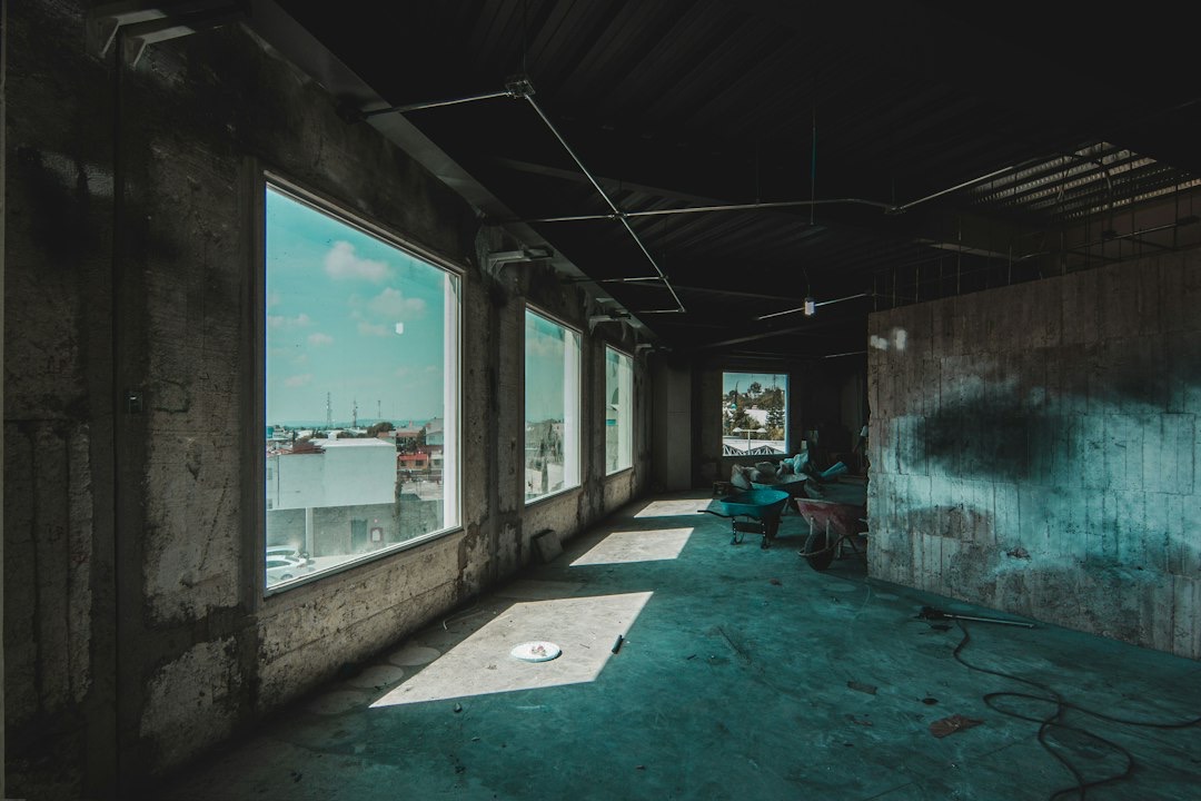 Concrete interior under construction with views of a distant city.